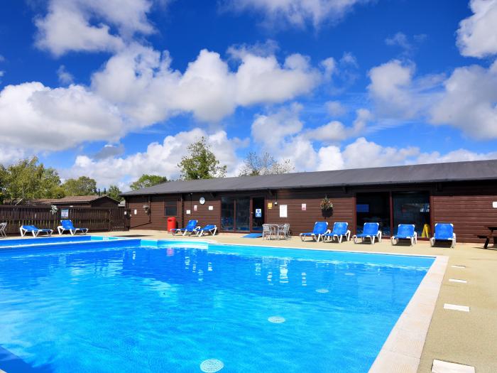 6 Pinewood Retreat near Lyme Regis, Devon. Communal indoor and outdoor swimming pools. Contemporary.