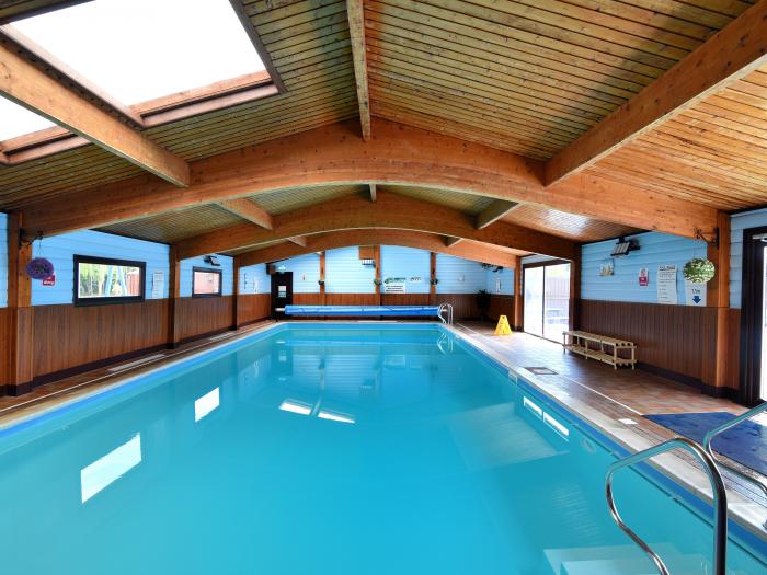 6 Pinewood Retreat near Lyme Regis, Devon. Communal indoor and outdoor swimming pools. Contemporary.