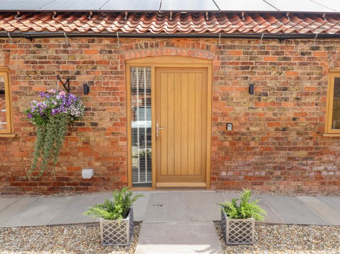 The Grange Cottage 1 in Ashby-cum-Fenby near Waltham, Lincolnshire. Hot tub. Near an AONB. Open plan