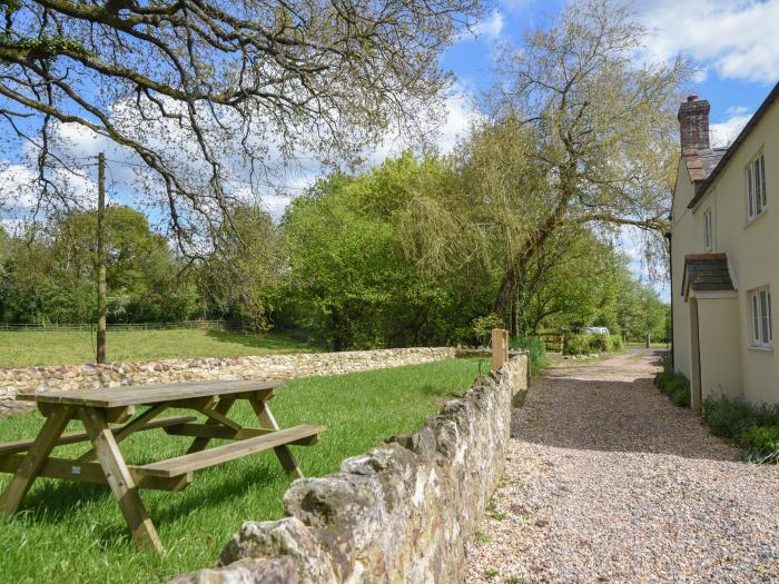 Riverbank, Dalwood, East Devon. Off-road parking. In an AONB. Garden. 2 dogs welcome. Three bedroom.