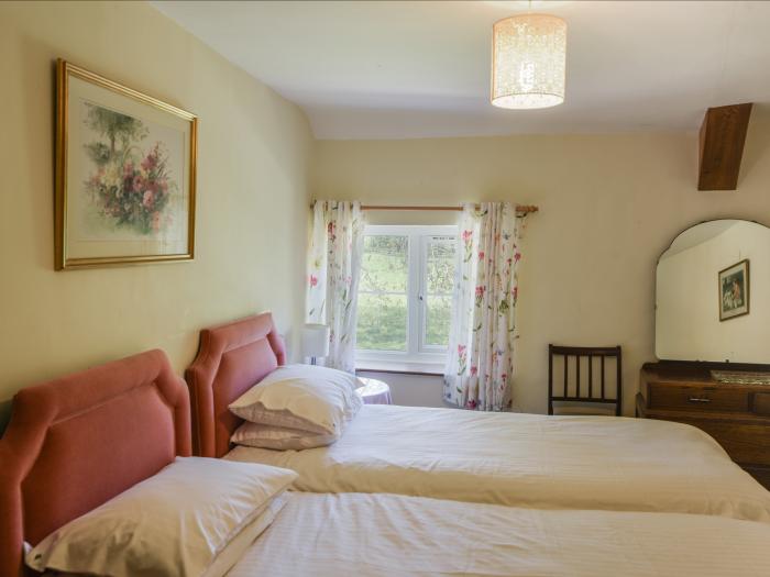 Riverbank, Dalwood, East Devon. Off-road parking. In an AONB. Garden. 2 dogs welcome. Three bedroom.