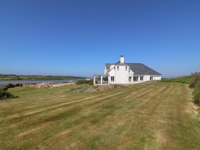 Wig Carna nr Holyhead, Anglesey. 4-bedroom home resting near the beach with sea views. Pet-friendly.