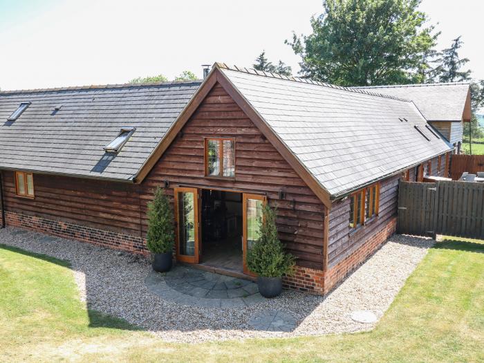 Awelfan is near Bettws Cedewain, Powys. Three-bedroom, barn conversion. Hot tub and enclosed garden.