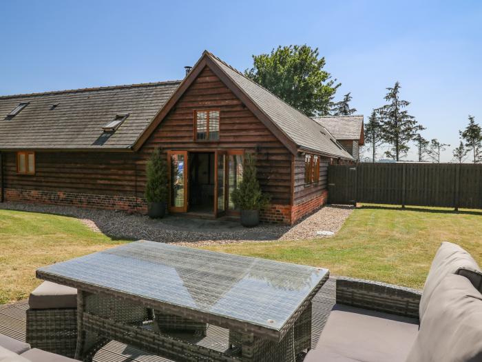 Awelfan is near Bettws Cedewain, Powys. Three-bedroom, barn conversion. Hot tub and enclosed garden.