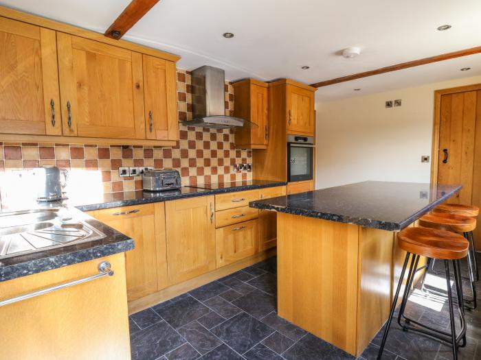 Awelfan is near Bettws Cedewain, Powys. Three-bedroom, barn conversion. Hot tub and enclosed garden.