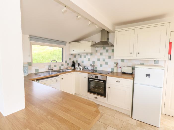 Siesta Chalet in Eype, Dorset. Open-plan living. Coastal location. Sea views. Child-friendly. 2-bed.