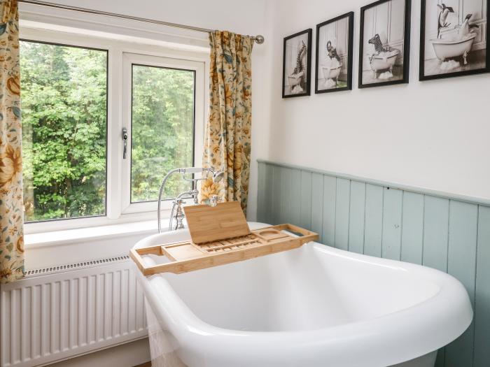 Min Y Nant is near Llangadfan, Powys. Three-bedroom cottage with riverside views. Wood-fired hot tub