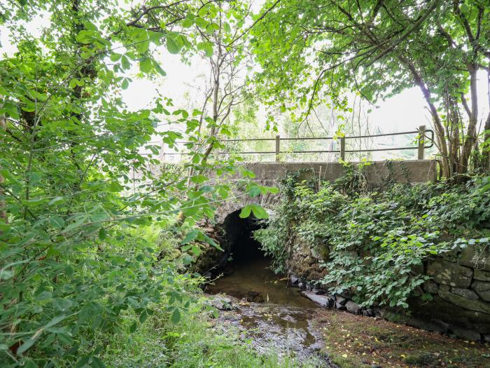 Min Y Nant is near Llangadfan, Powys. Three-bedroom cottage with riverside views. Wood-fired hot tub