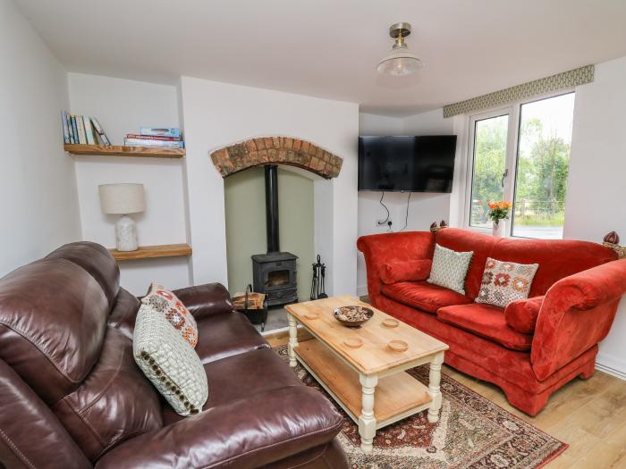Min Y Nant is near Llangadfan, Powys. Three-bedroom cottage with riverside views. Wood-fired hot tub