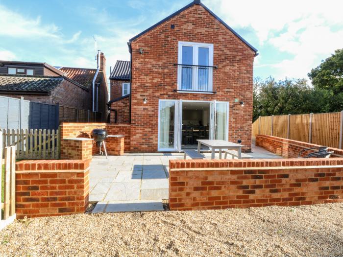 Well Cottage, is near Loddon, Norfolk. Four-bedroom home with enclosed garden and woodburning stove.