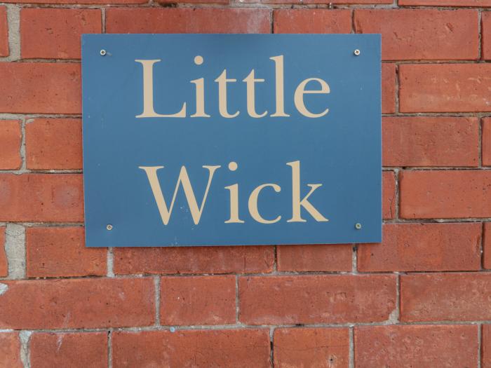 Little Wick is in Lympsham, Somerset. Two-bedroom stable conversion. Enclosed, pretty garden. Family