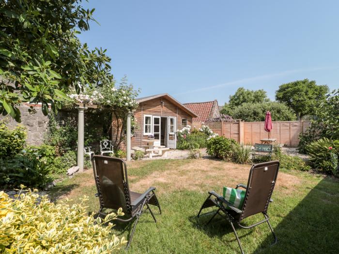 Little Wick is in Lympsham, Somerset. Two-bedroom stable conversion. Enclosed, pretty garden. Family