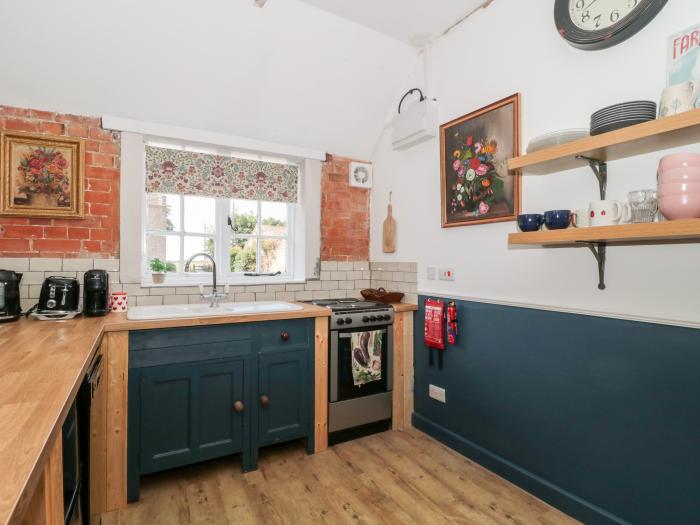 Little Wick is in Lympsham, Somerset. Two-bedroom stable conversion. Enclosed, pretty garden. Family