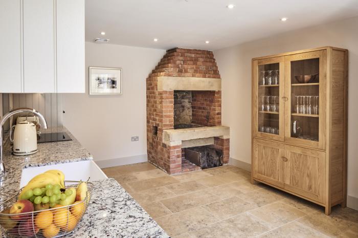 The Smithy is in Humshaugh, Northumberland. Three-bedroom home with woodburning stove. Contemporary.