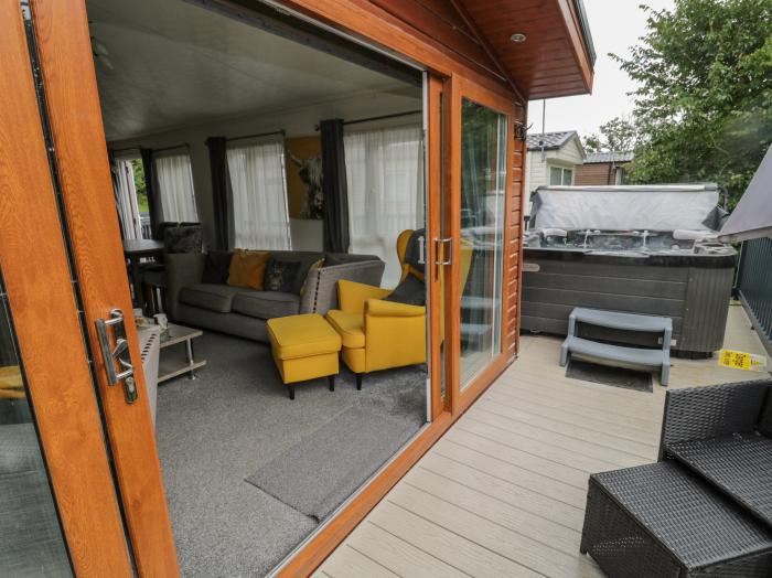 Mulberry lodge, in Felton, Northumberland. Three-bedroom lodge with wrap-around decking and hot tub.