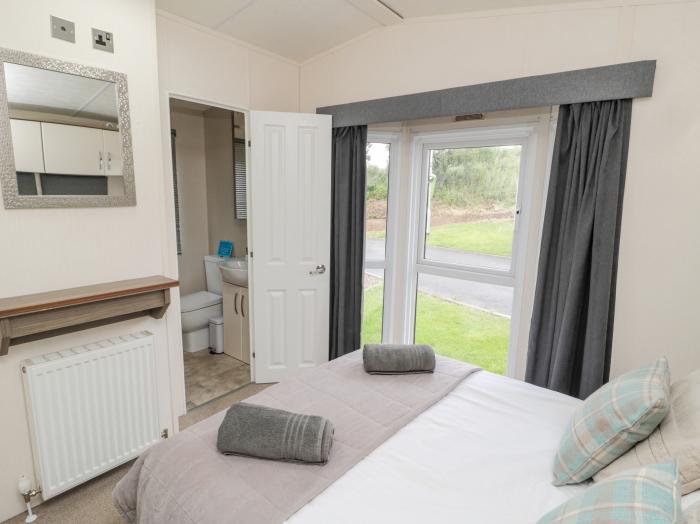 Mulberry lodge, in Felton, Northumberland. Three-bedroom lodge with wrap-around decking and hot tub.