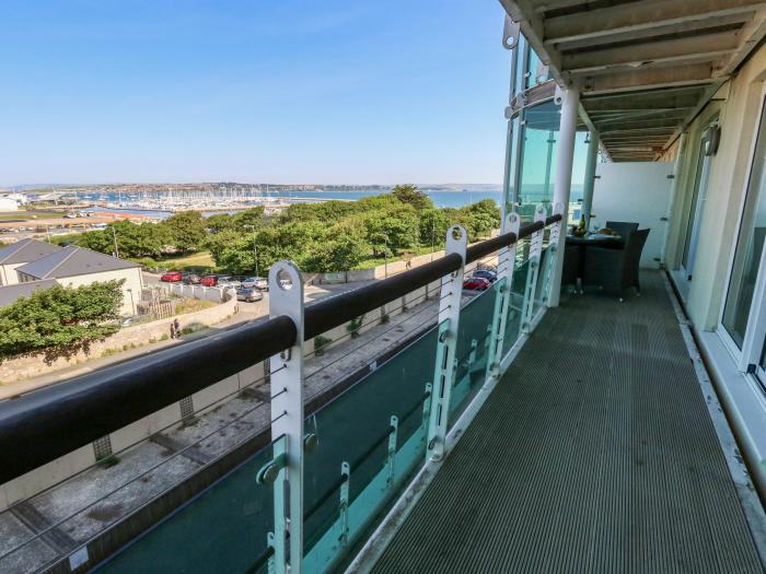 65 Atlantic House, Castletown, Portland. Exceptional views. Open-plan. Balcony with furniture. 2 bed