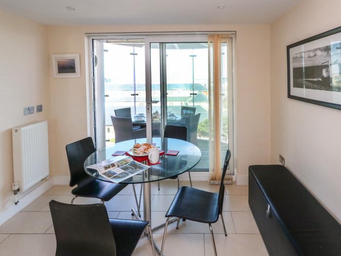 65 Atlantic House, Castletown, Portland. Exceptional views. Open-plan. Balcony with furniture. 2 bed