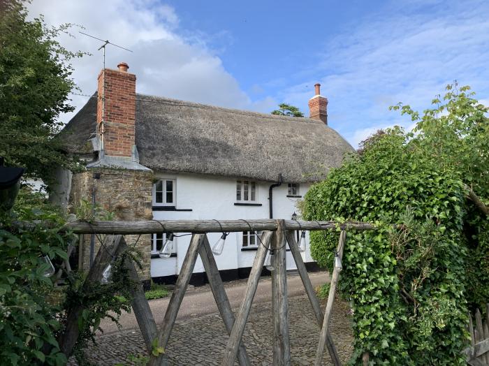 Brewers Cottage rests in Kings Nympton, Devon. Two-bedroom home near a pub. Woodburning stove. Pets.