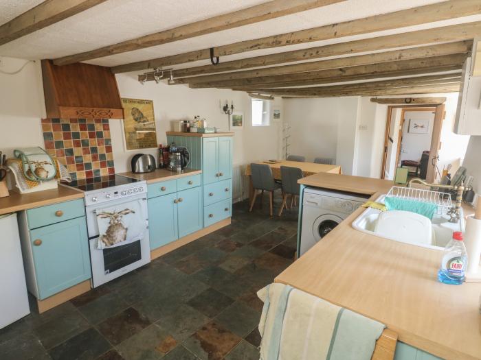 Brewers Cottage rests in Kings Nympton, Devon. Two-bedroom home near a pub. Woodburning stove. Pets.