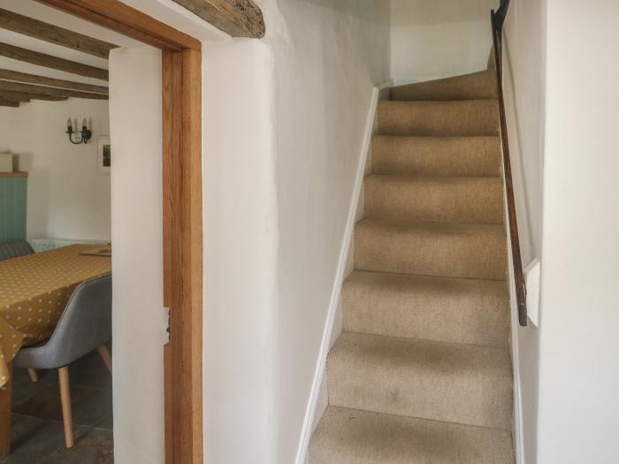 Brewers Cottage rests in Kings Nympton, Devon. Two-bedroom home near a pub. Woodburning stove. Pets.