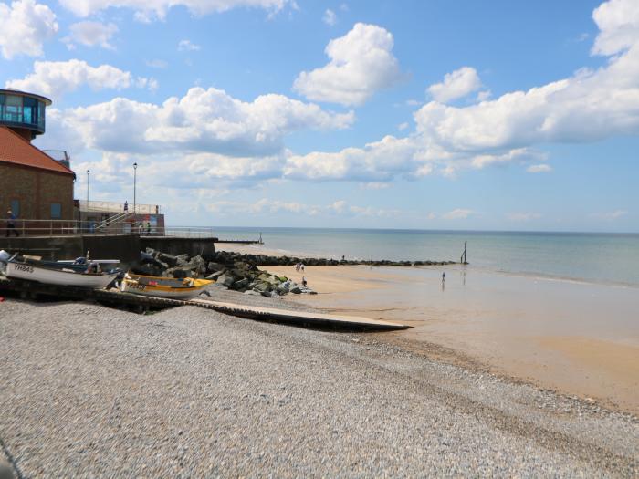 Roof Top, is in Sheringham, Norfolk. Close to amenities and a beach. Roadside parking. Near an AONB.