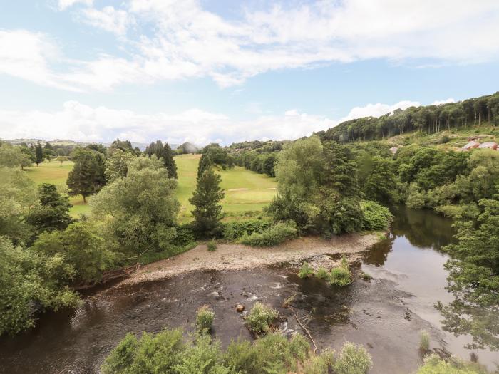 Rock House Apartment, Llanllwchaiarn near Newtown, Powys. Riverside apartment. Couple's retreat. TV.