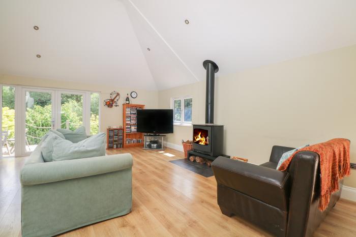 Garden Cottage, in Farnham, Surrey. Ground-floor living. Dog-friendly. Open-plan. Woodburning stove.