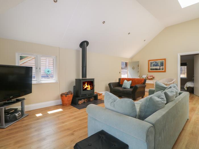 Garden Cottage, in Farnham, Surrey. Ground-floor living. Dog-friendly. Open-plan. Woodburning stove.