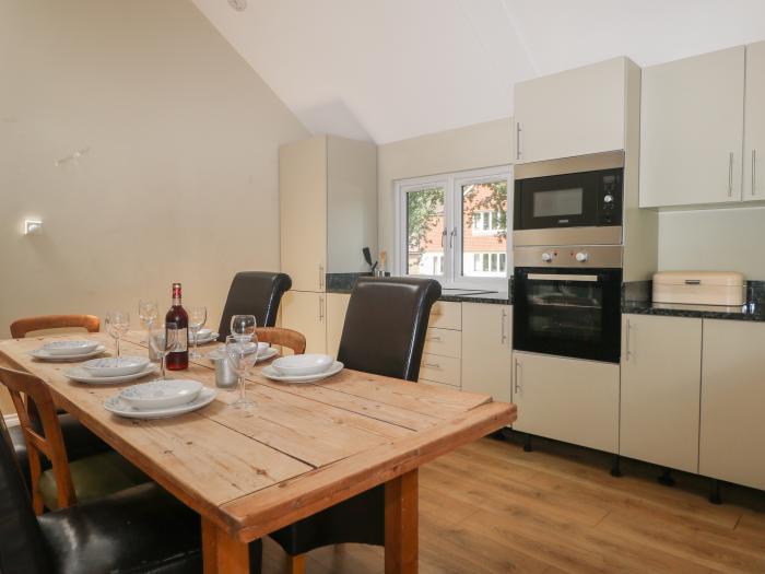 Garden Cottage, in Farnham, Surrey. Ground-floor living. Dog-friendly. Open-plan. Woodburning stove.