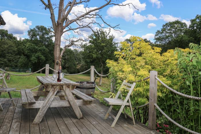 Garden Cottage, in Farnham, Surrey. Ground-floor living. Dog-friendly. Open-plan. Woodburning stove.