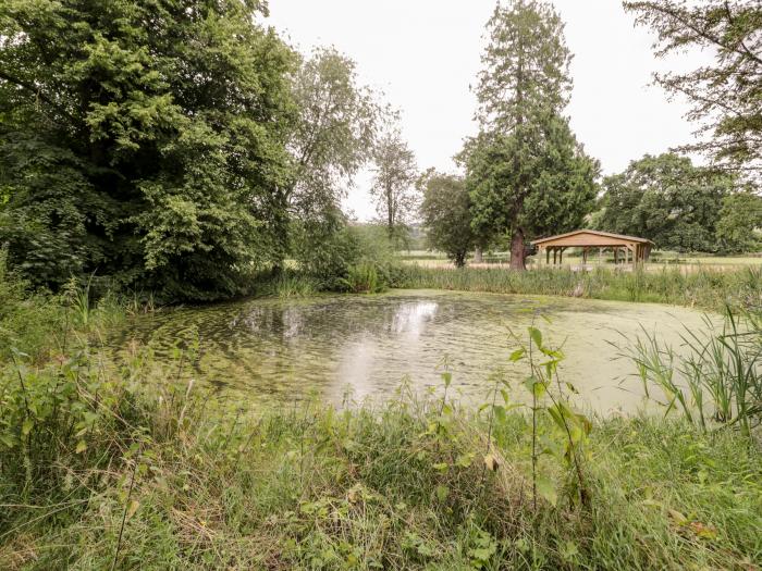 Lower Gardener's Cottage in Llandyrnog near Denbigh, Denbighshire. Off-road parking. Hot tub. Pets.