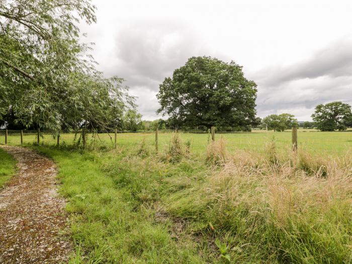 Lower Gardener's Cottage in Llandyrnog near Denbigh, Denbighshire. Off-road parking. Hot tub. Pets.