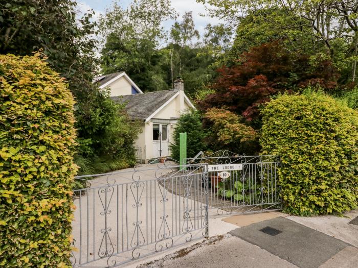 The Lodge, is in Ambleside, Cumbria. In Lake District National Park. Off-road parking. Near a lake.
