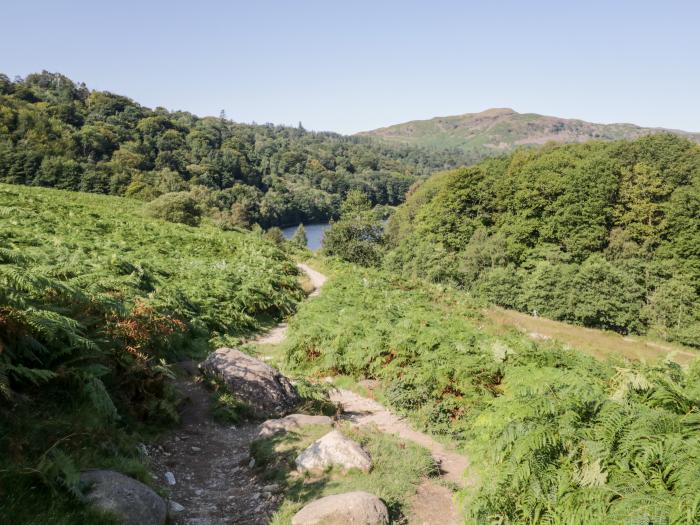 The Lodge, is in Ambleside, Cumbria. In Lake District National Park. Off-road parking. Near a lake.