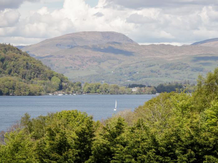 The Lodge, is in Ambleside, Cumbria. In Lake District National Park. Off-road parking. Near a lake.