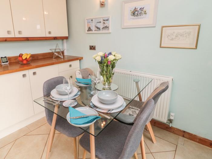 Coast Cottage, Bamburgh, Northumberland. Two-bedroom home resting near the beach and amenities. Pets