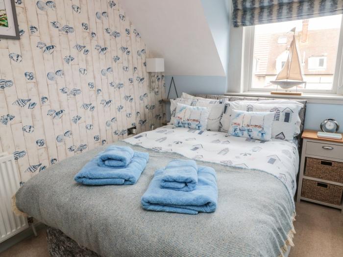 Coast Cottage, Bamburgh, Northumberland. Two-bedroom home resting near the beach and amenities. Pets