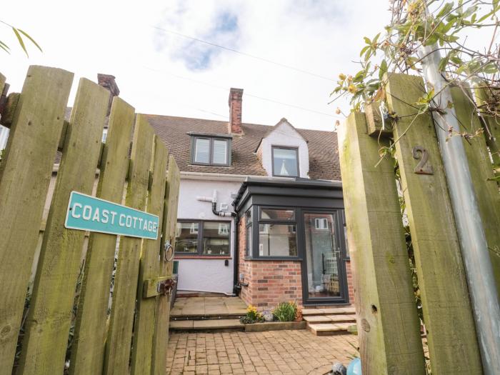 Coast Cottage, Bamburgh, Northumberland. Two-bedroom home resting near the beach and amenities. Pets