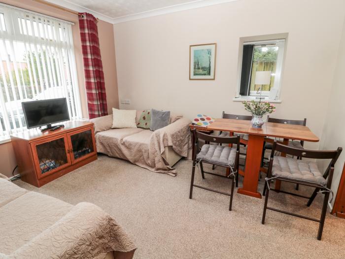 Golden Fleece Cottage in Lowick, Northumberland. Two-bedroom bungalow resting near amenities. Family