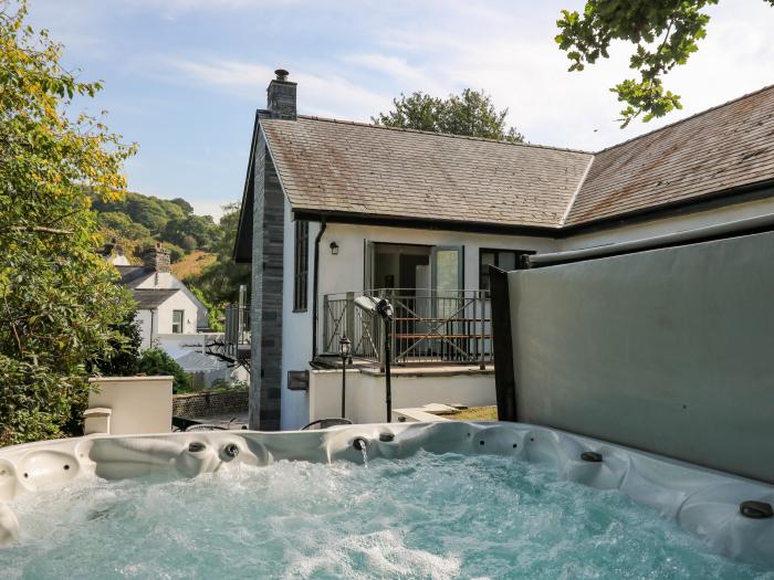 The Coach House at Plas Dolguog, in Machynlleth. Five-bedroom home with hot tub and enclosed garden.