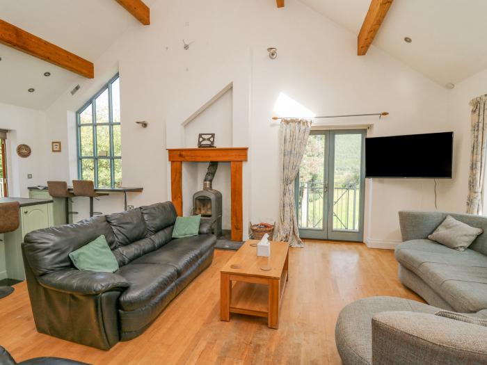 The Coach House at Plas Dolguog, in Machynlleth. Five-bedroom home with hot tub and enclosed garden.