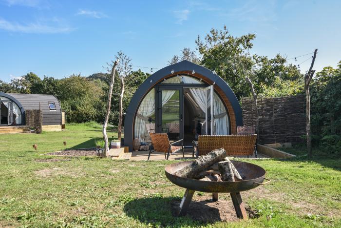 Cedar, located near Charmouth, Dorset. Two-bedroom pod, enjoying rural views. Pet-friendly. Stylish.