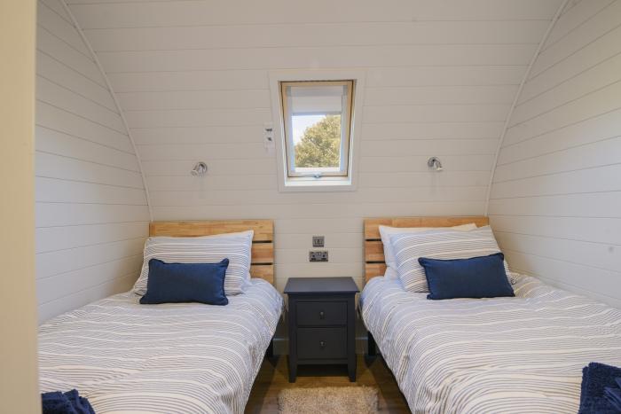 Cedar, located near Charmouth, Dorset. Two-bedroom pod, enjoying rural views. Pet-friendly. Stylish.