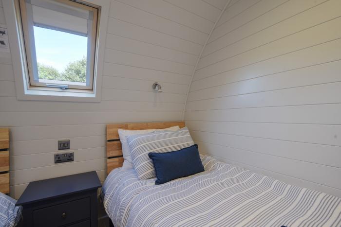 Cedar, located near Charmouth, Dorset. Two-bedroom pod, enjoying rural views. Pet-friendly. Stylish.