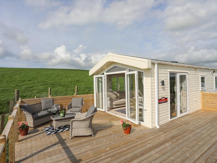 Cae'r Wylan is in Aberdaron, Gwynedd. Two-bedroom lodge enjoying rural and sea views. Stylish. Pets.