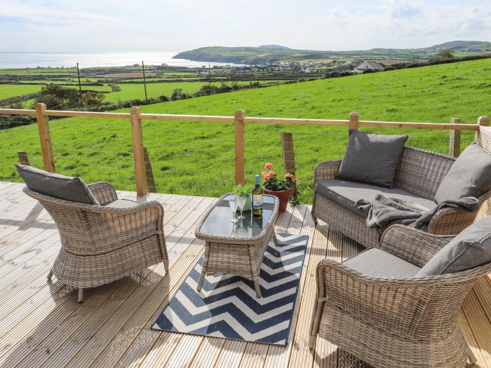 Cae'r Wylan is in Aberdaron, Gwynedd. Two-bedroom lodge enjoying rural and sea views. Stylish. Pets.