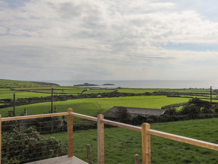 Cae'r Wylan is in Aberdaron, Gwynedd. Two-bedroom lodge enjoying rural and sea views. Stylish. Pets.