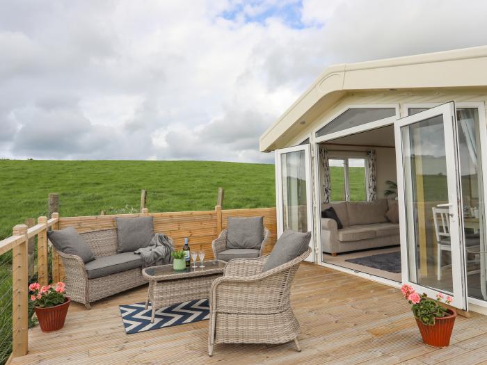 Cae'r Wylan is in Aberdaron, Gwynedd. Two-bedroom lodge enjoying rural and sea views. Stylish. Pets.