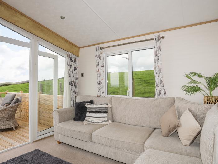 Cae'r Wylan is in Aberdaron, Gwynedd. Two-bedroom lodge enjoying rural and sea views. Stylish. Pets.